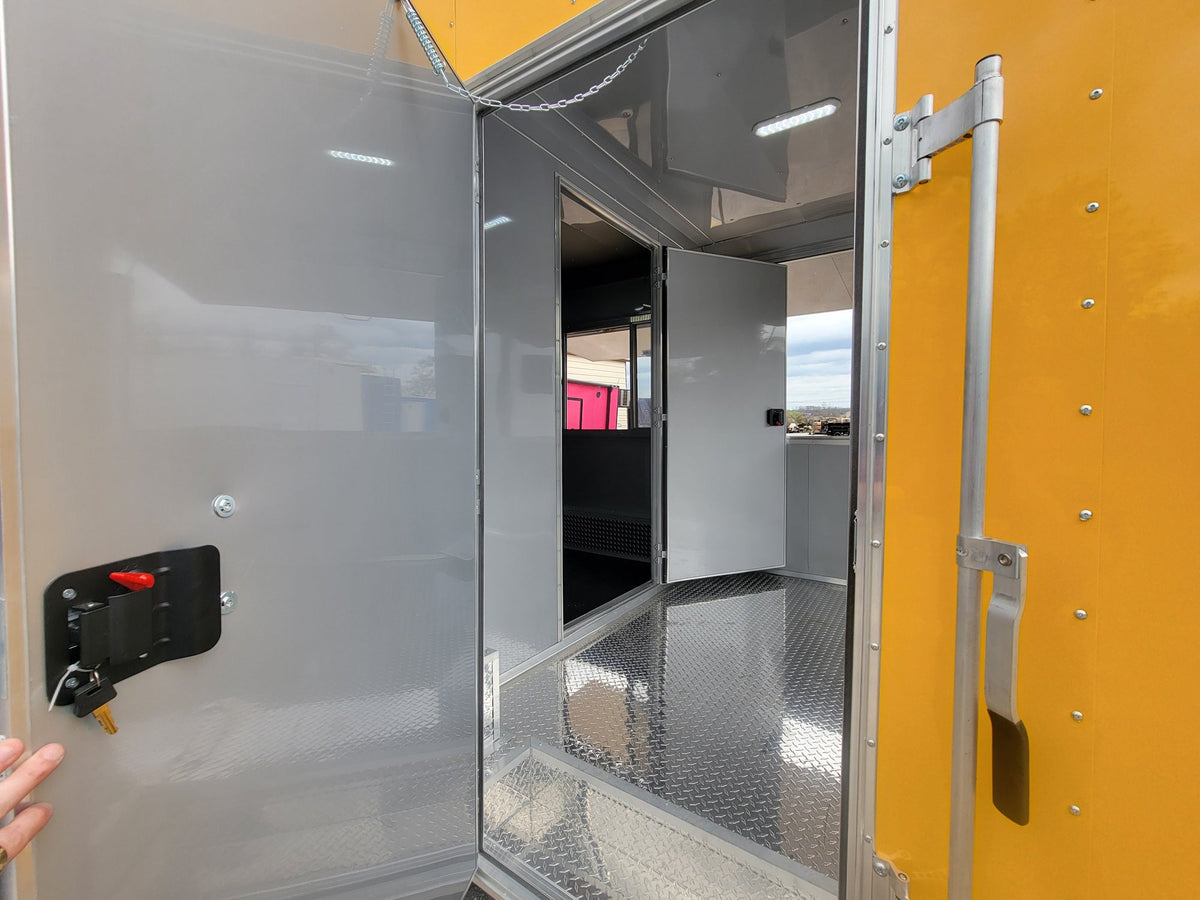 8.5' x 28' Custom Enclosed Yellow With 9' Porch With Lower Barn Door